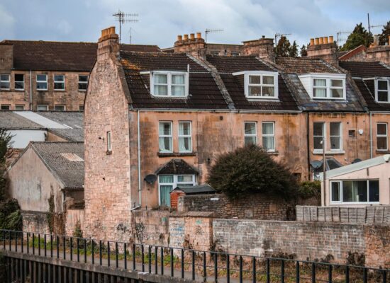 Traditional stone terraced houses in Bath, England, showcasing classic architecture.